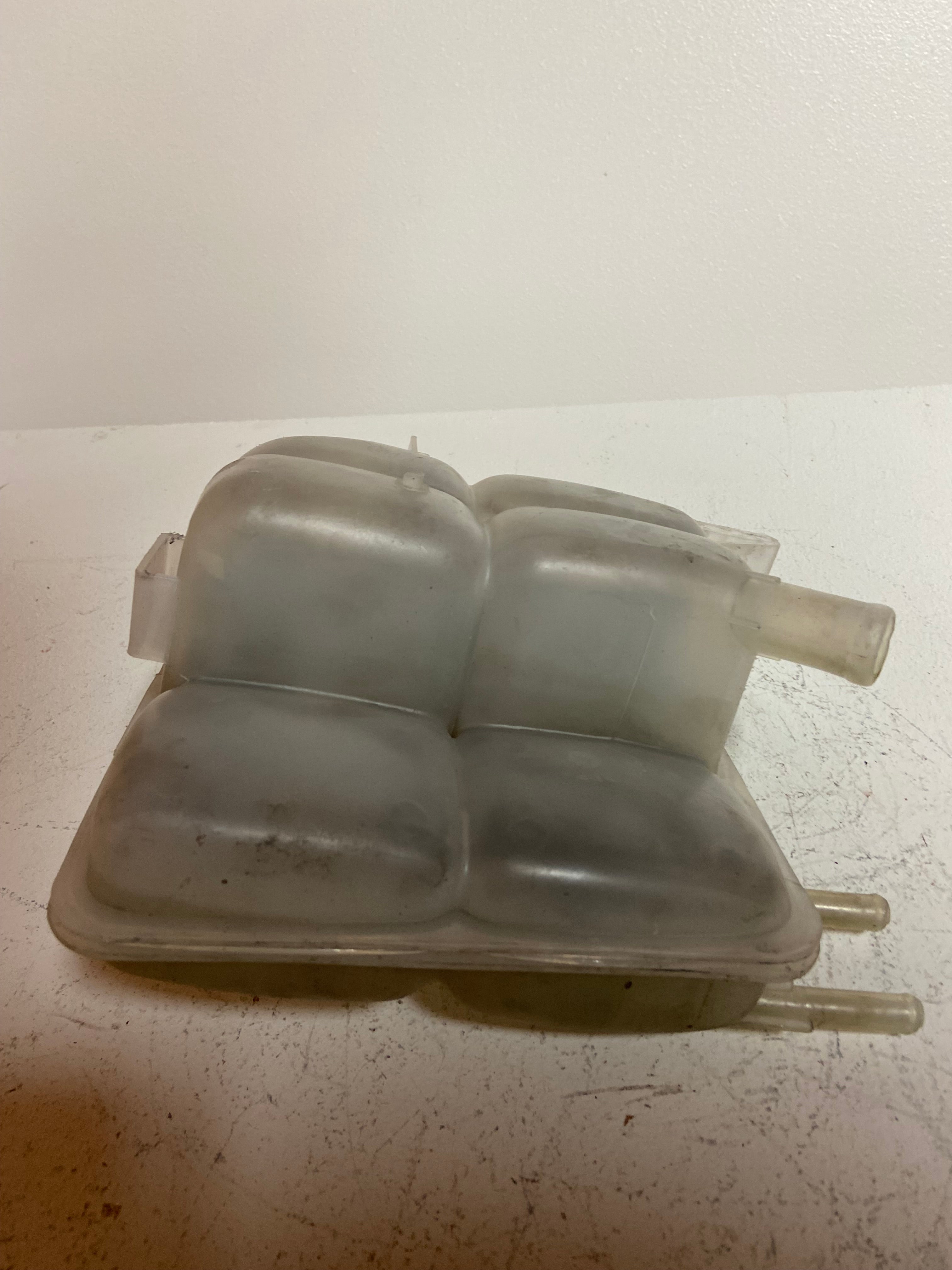 Engine coolant reservoir tank, light gray plastic with two hose ports