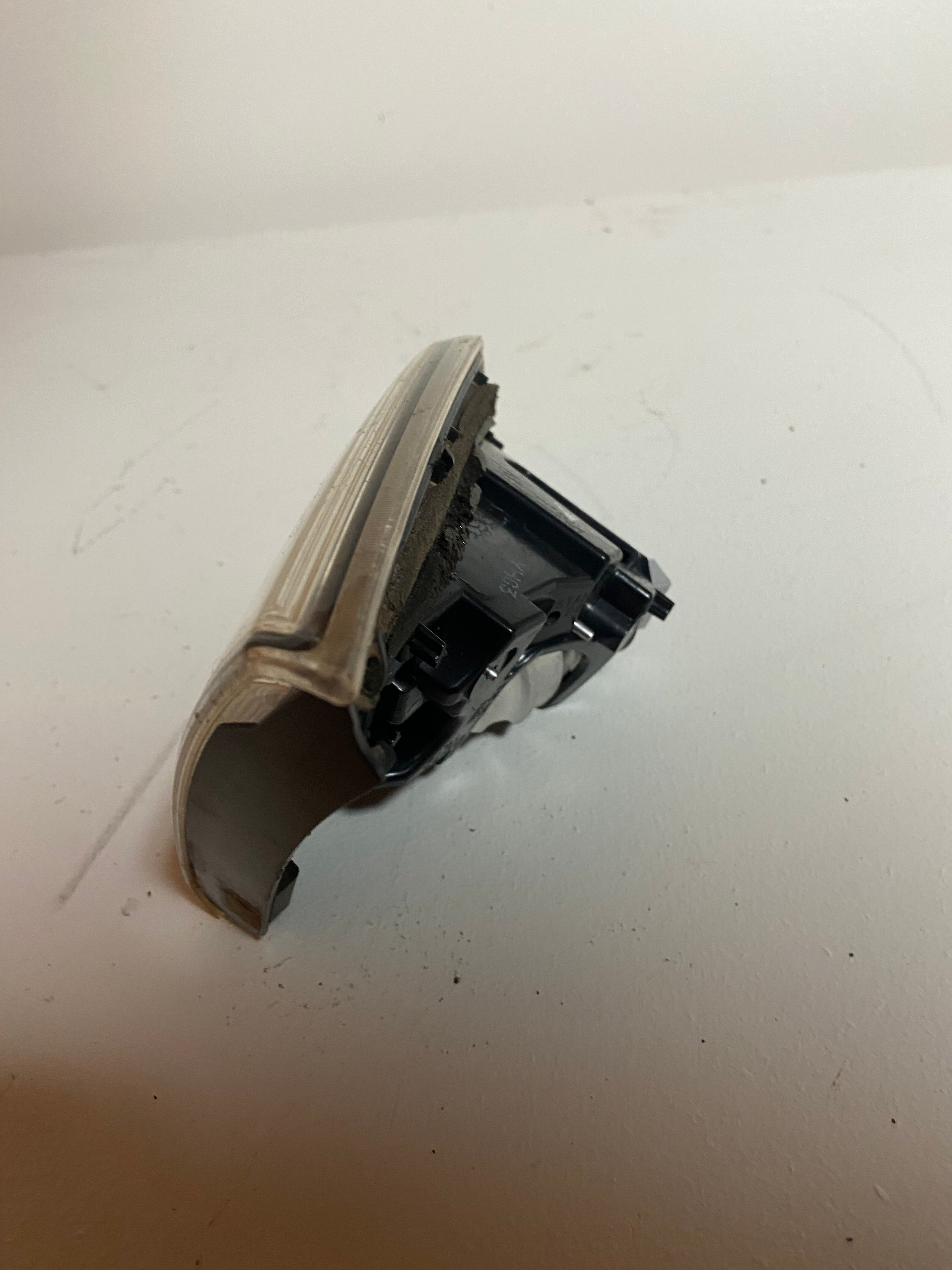 Right rear tail light and reverse lamp assembly, angled view of lens and housing