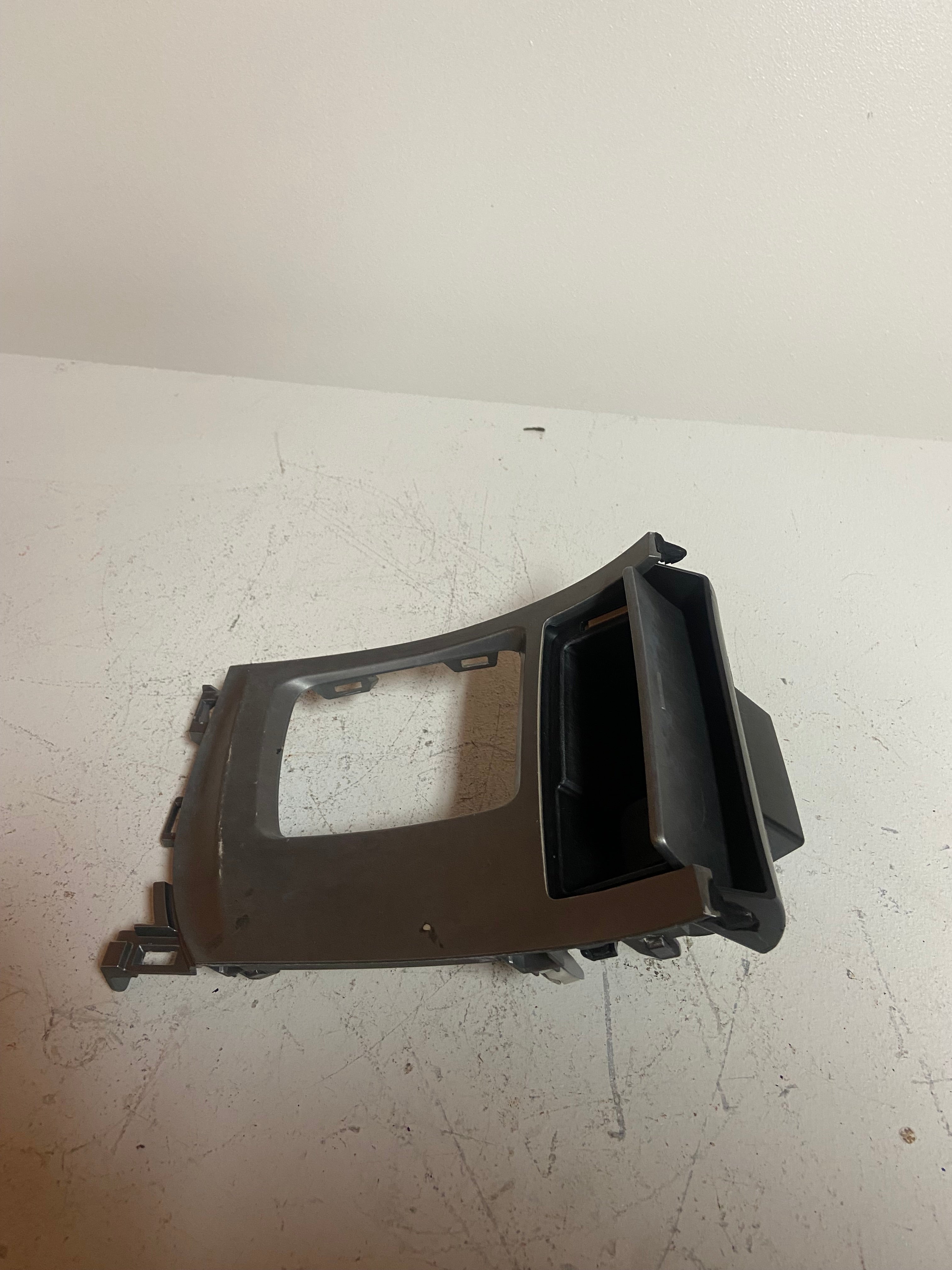 Shifter trim bezel frame with rectangular opening and black side trim