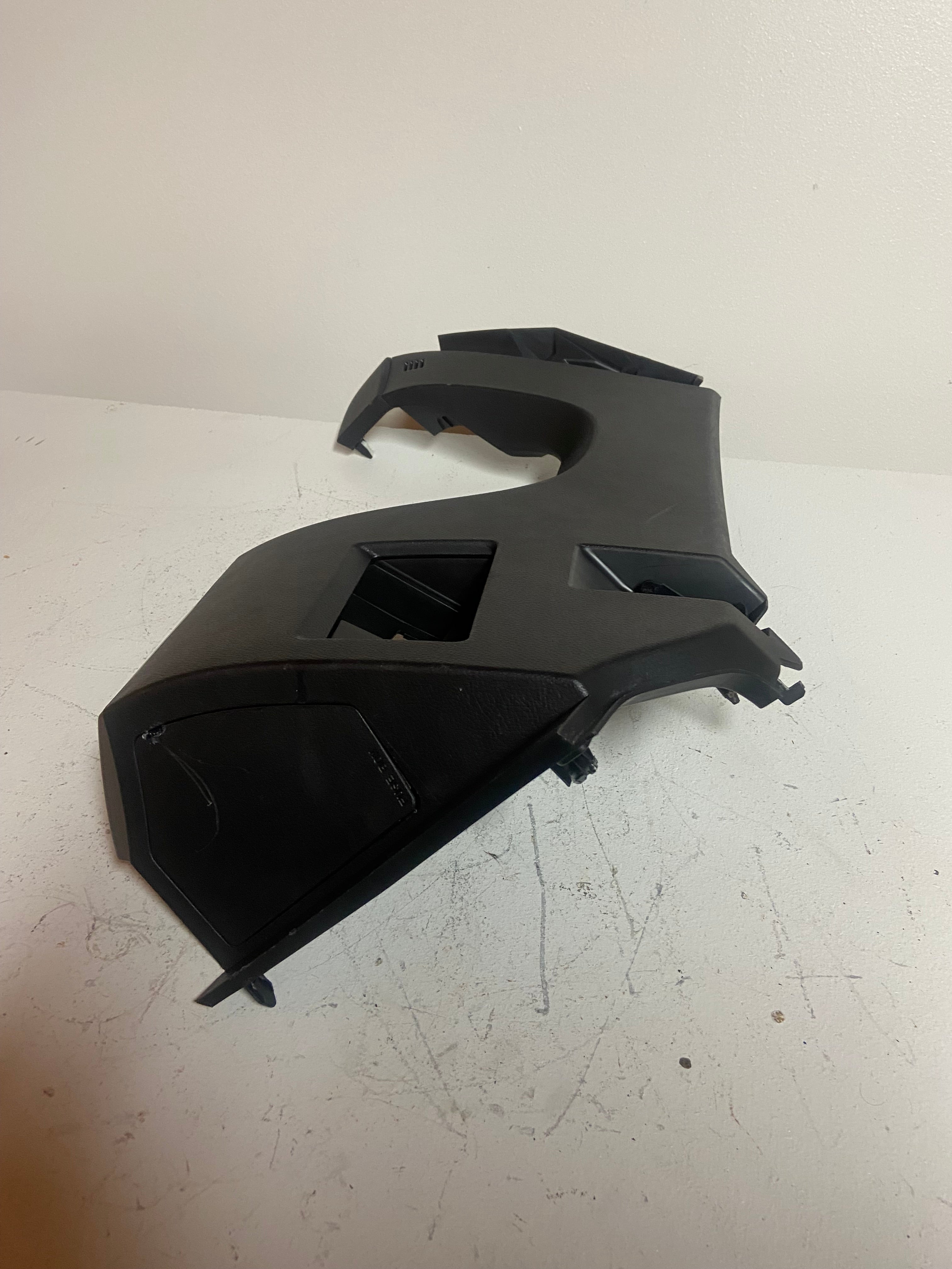 Black interior trim panels set with vent cutouts and mounting tabs
