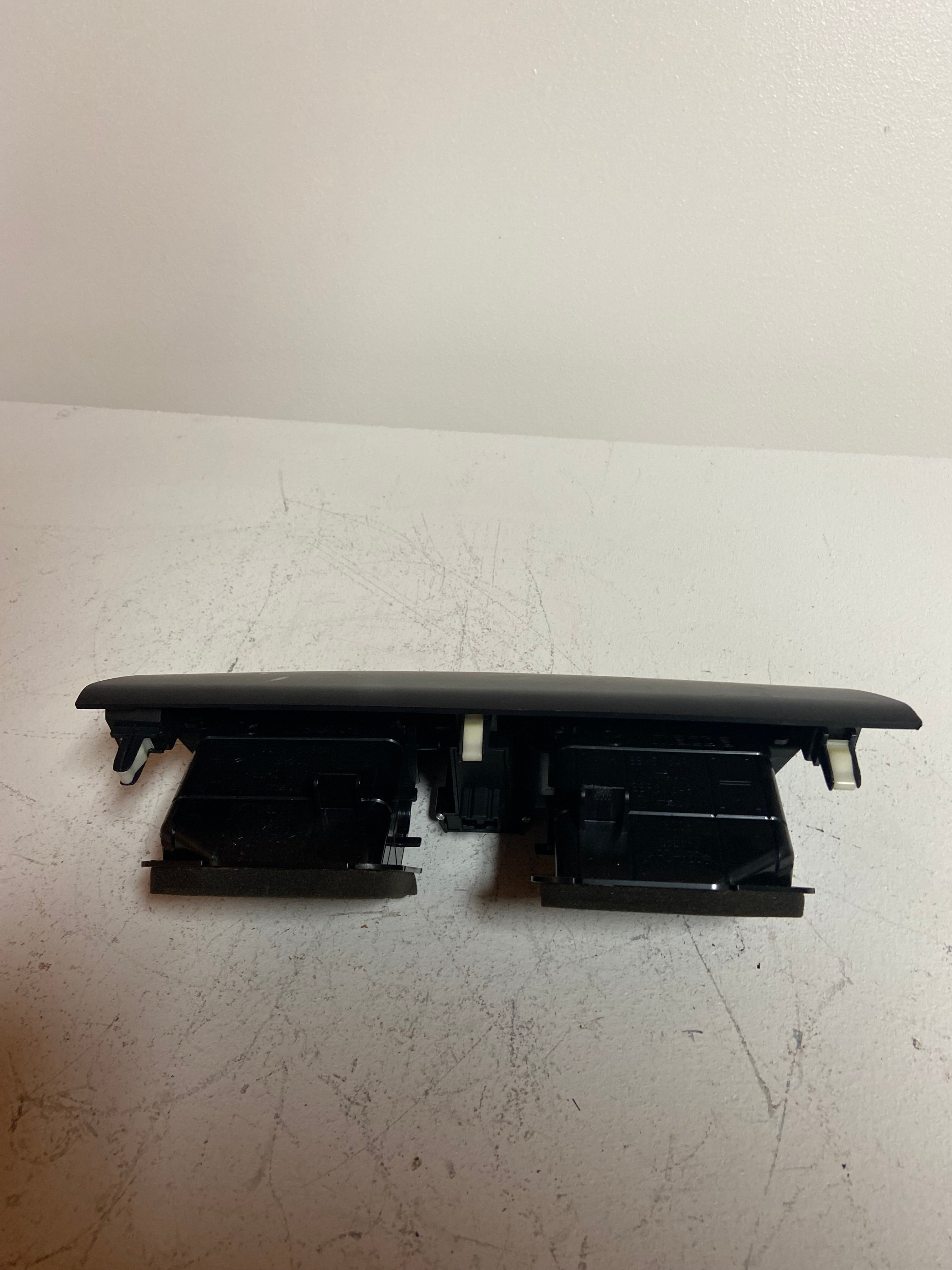 Center A/C vent and hazard switch assembly, black panel with front openings