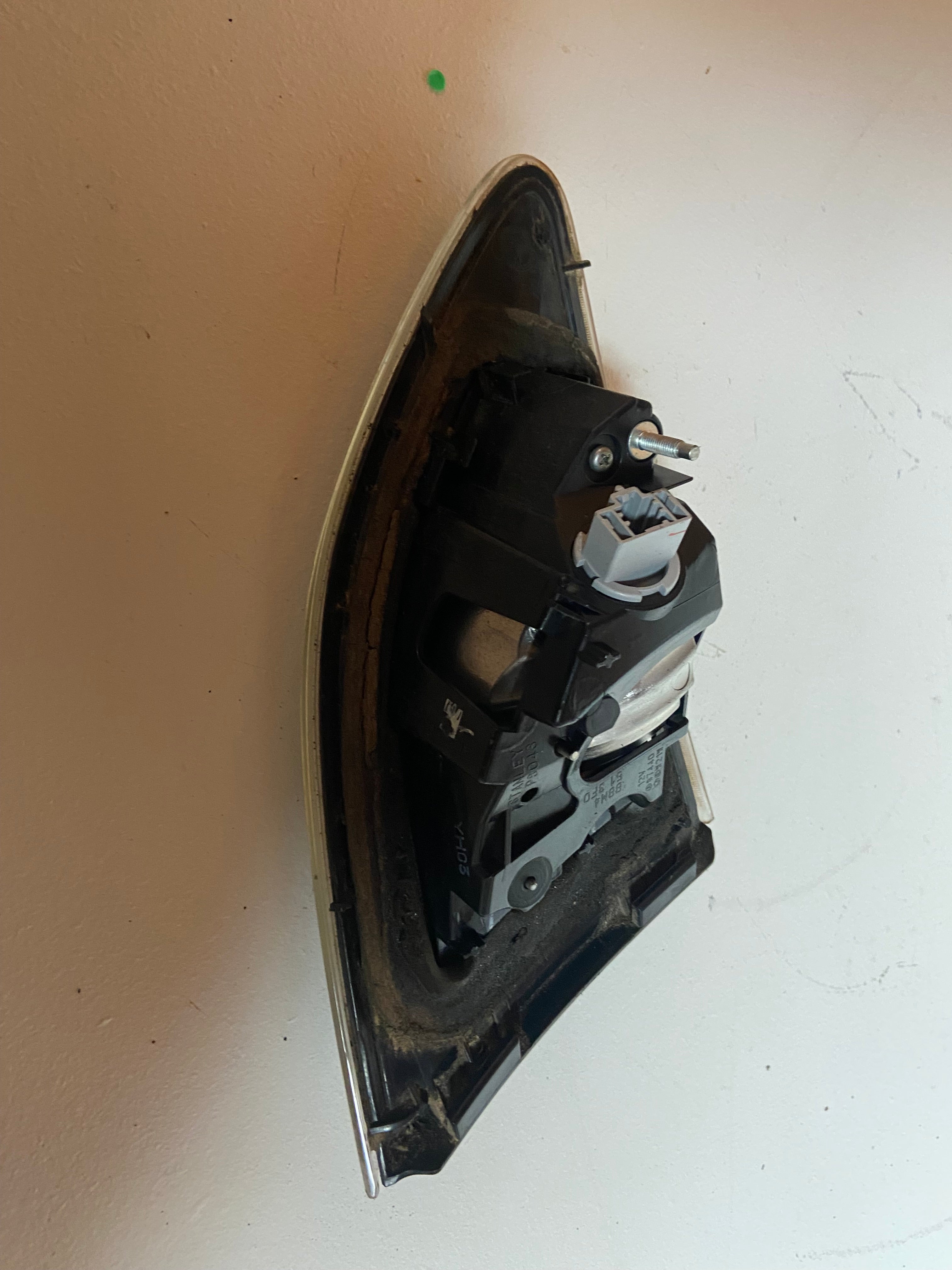 Right rear tail light and reverse lamp assembly, rear housing with wiring plug