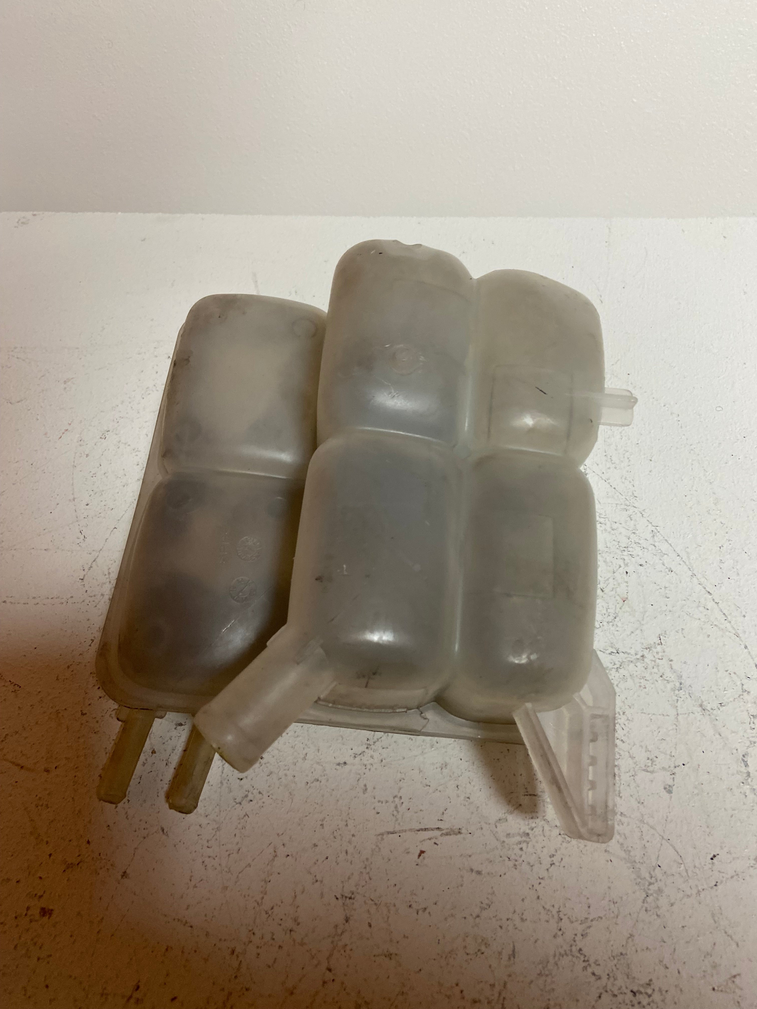 Engine coolant reservoir tank, light gray plastic with side outlet and hose ports