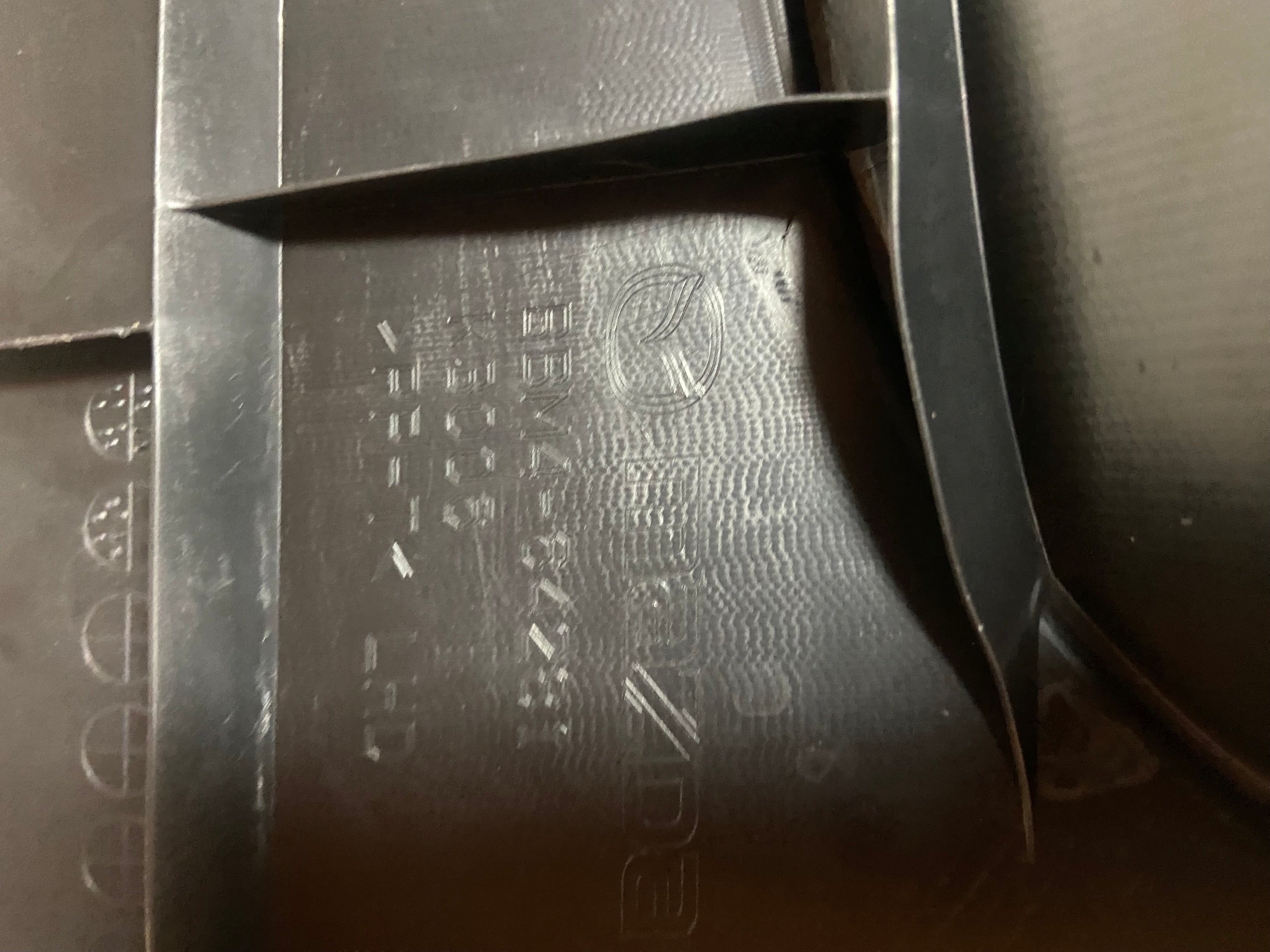 Black textured trim panel with molded cutout recess