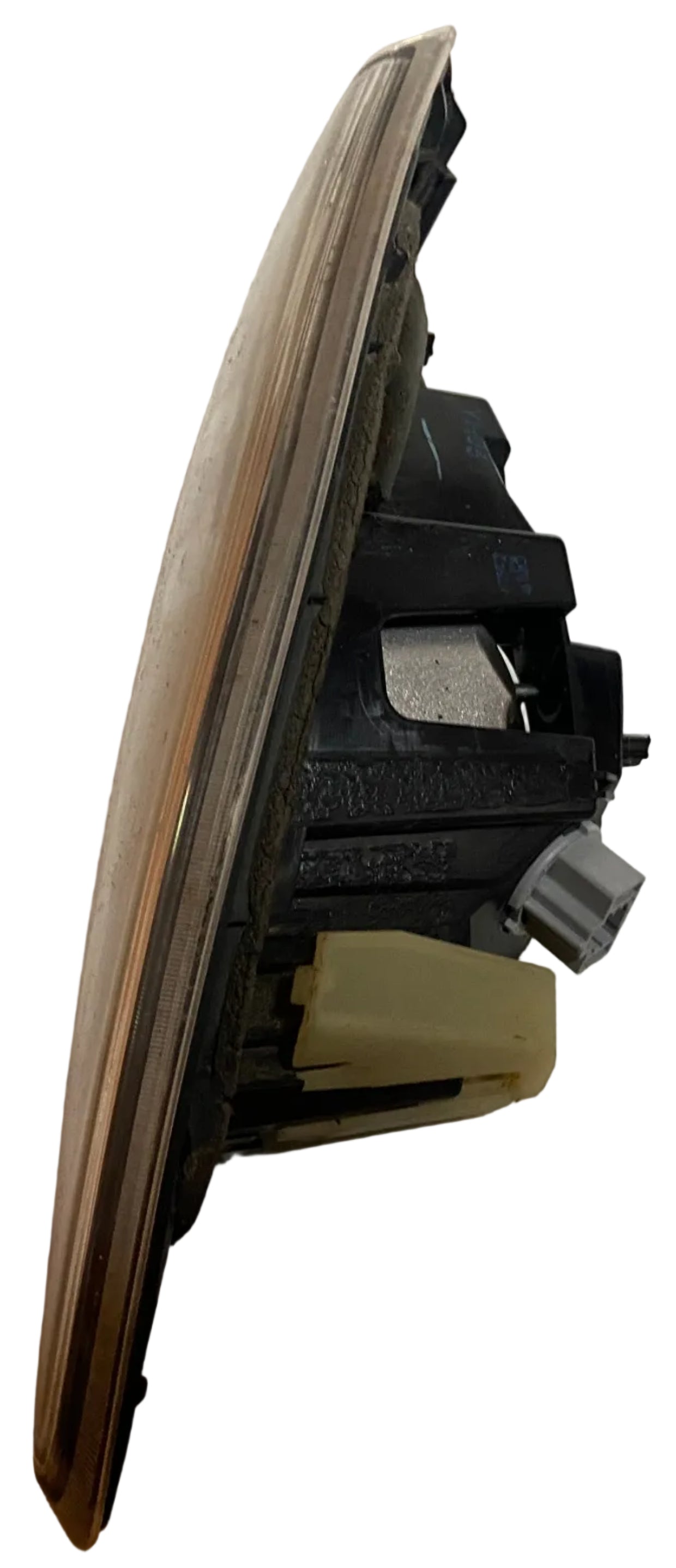 Left rear inner tail light/reverse lamp assembly, angled view of lens and socket