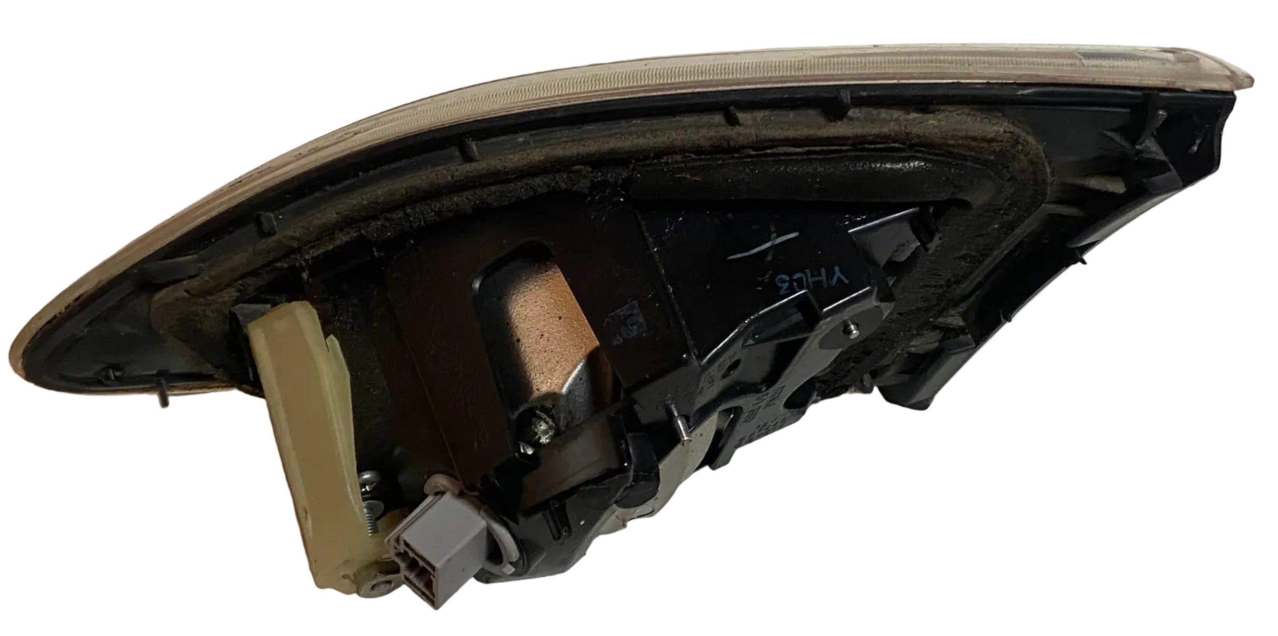 Left rear inner tail light/reverse lamp assembly, side view of black housing internals