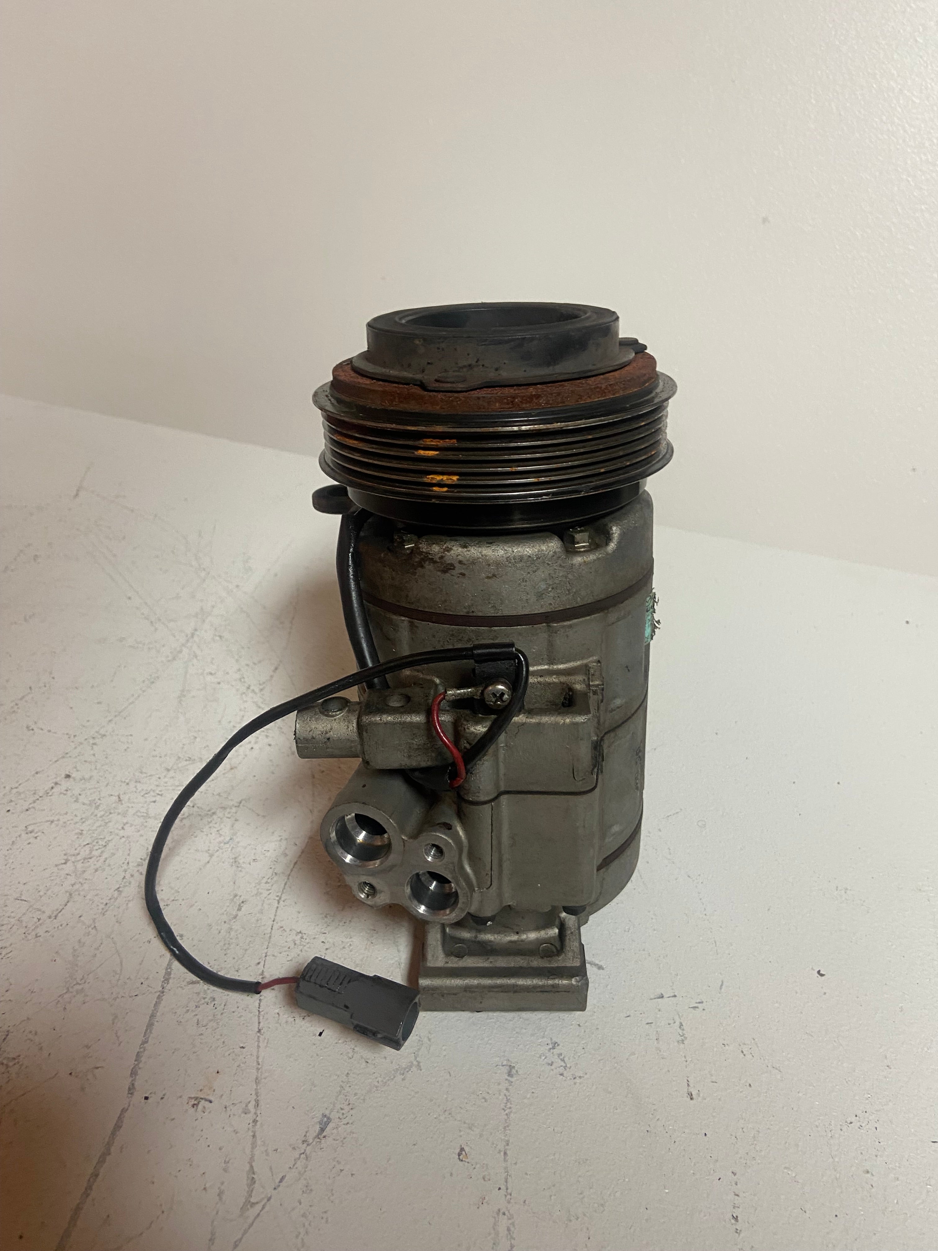 A/C compressor assembly with rusted pulley and side electrical module