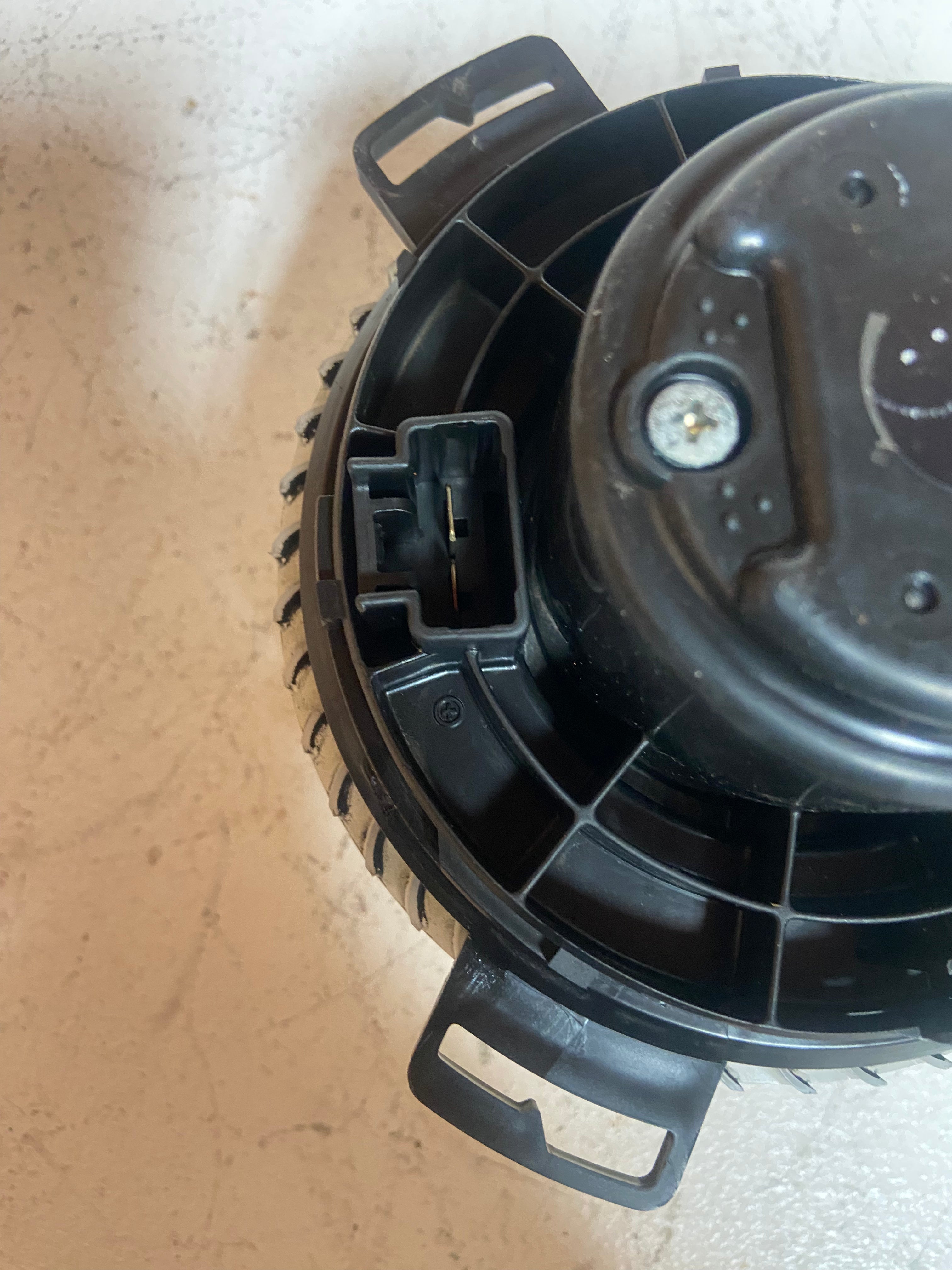 A/C heater blower motor with connector port and circular fan housing
