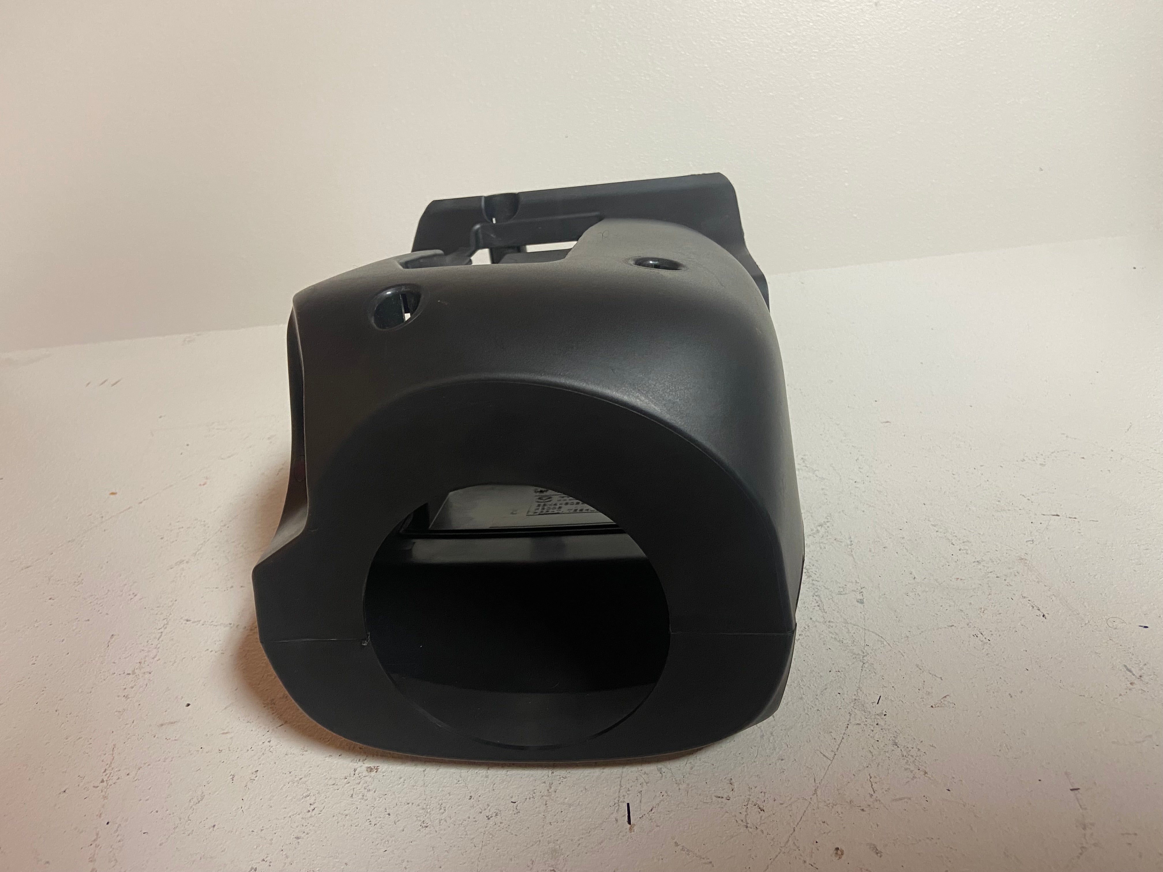Black plastic steering column shroud cover with large circular cutout