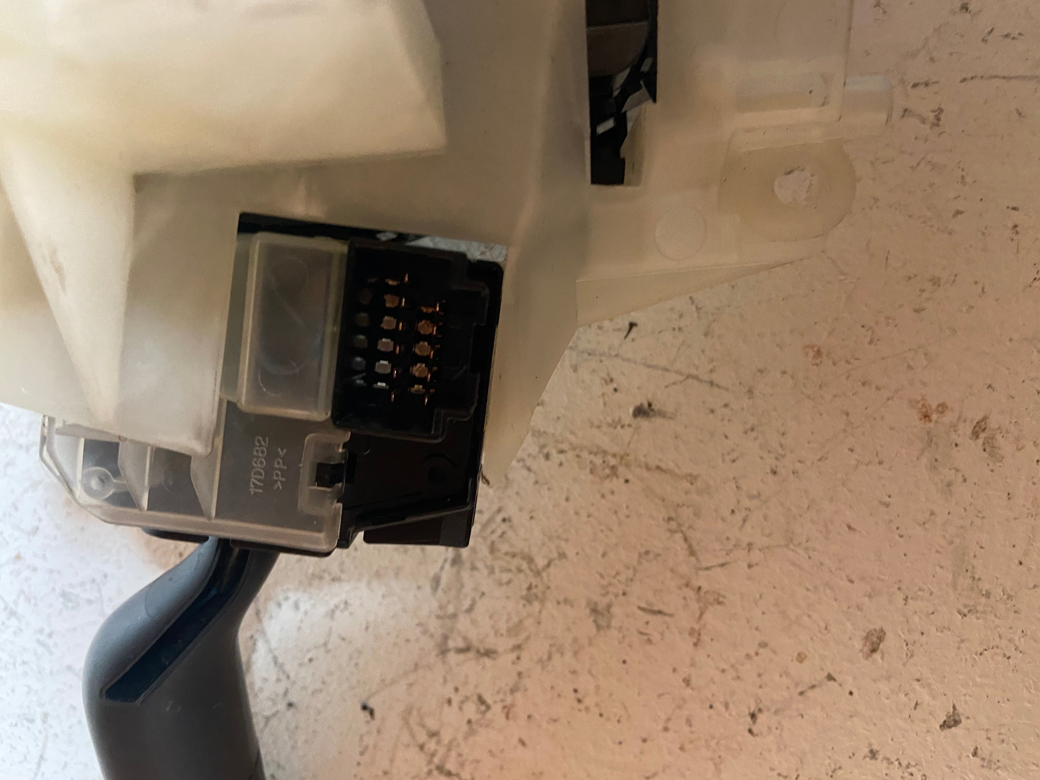 Steering column switch housing with black electrical connector and wiring