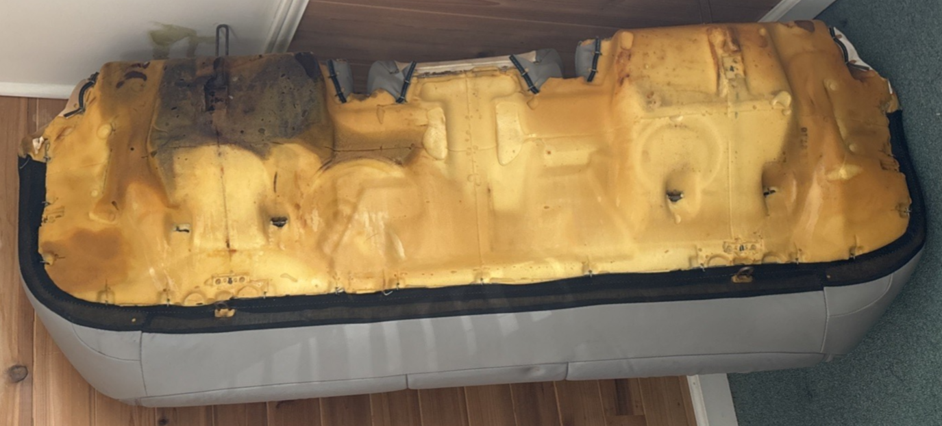 Yellow engine block on a white surface
