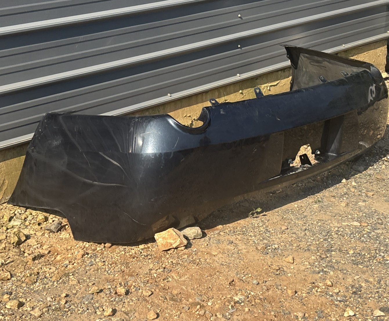 2006-2012 Chevrolet Impala Rear Bumper Cover *BLACK OEM 15285645