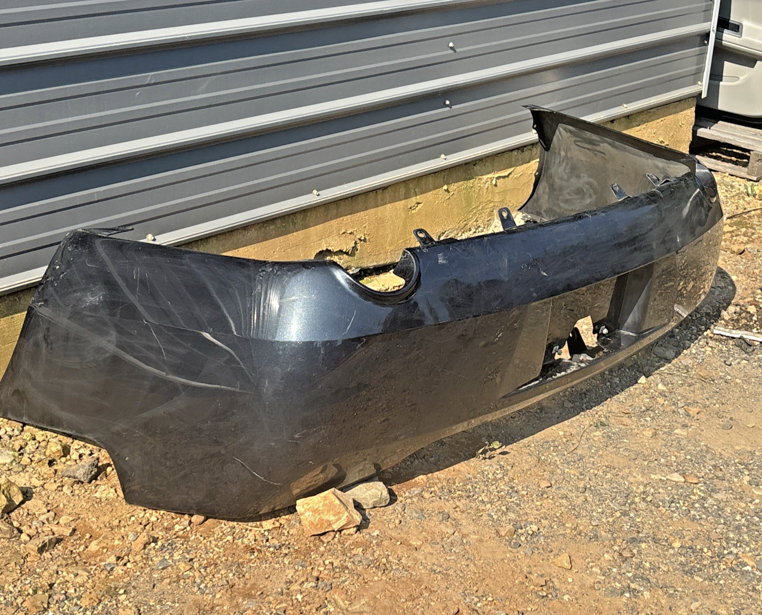 2006-2012 Chevrolet Impala Rear Bumper Cover *BLACK OEM 15285645