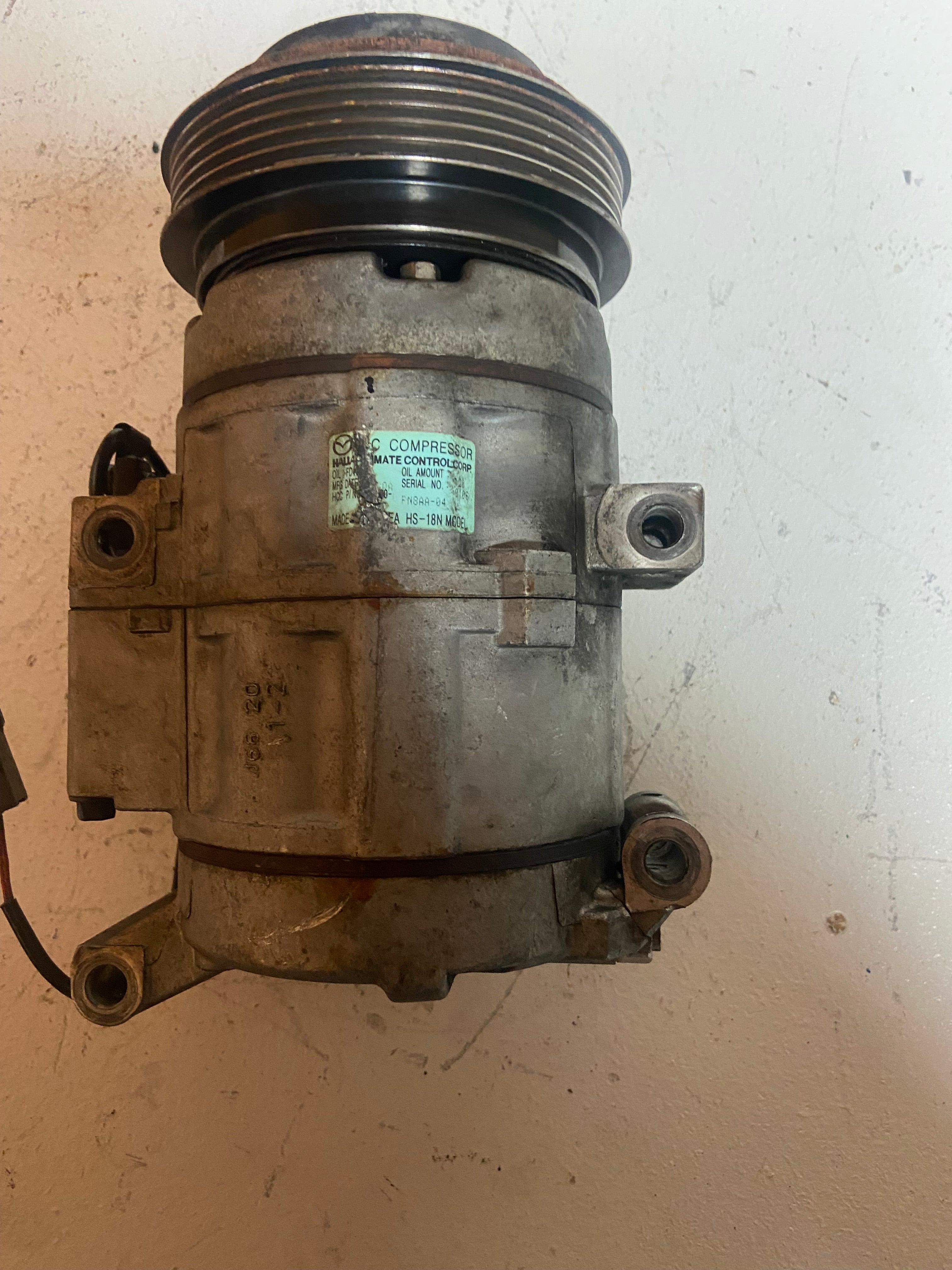 A/C compressor with threaded pulley front and electrical/vacuum ports