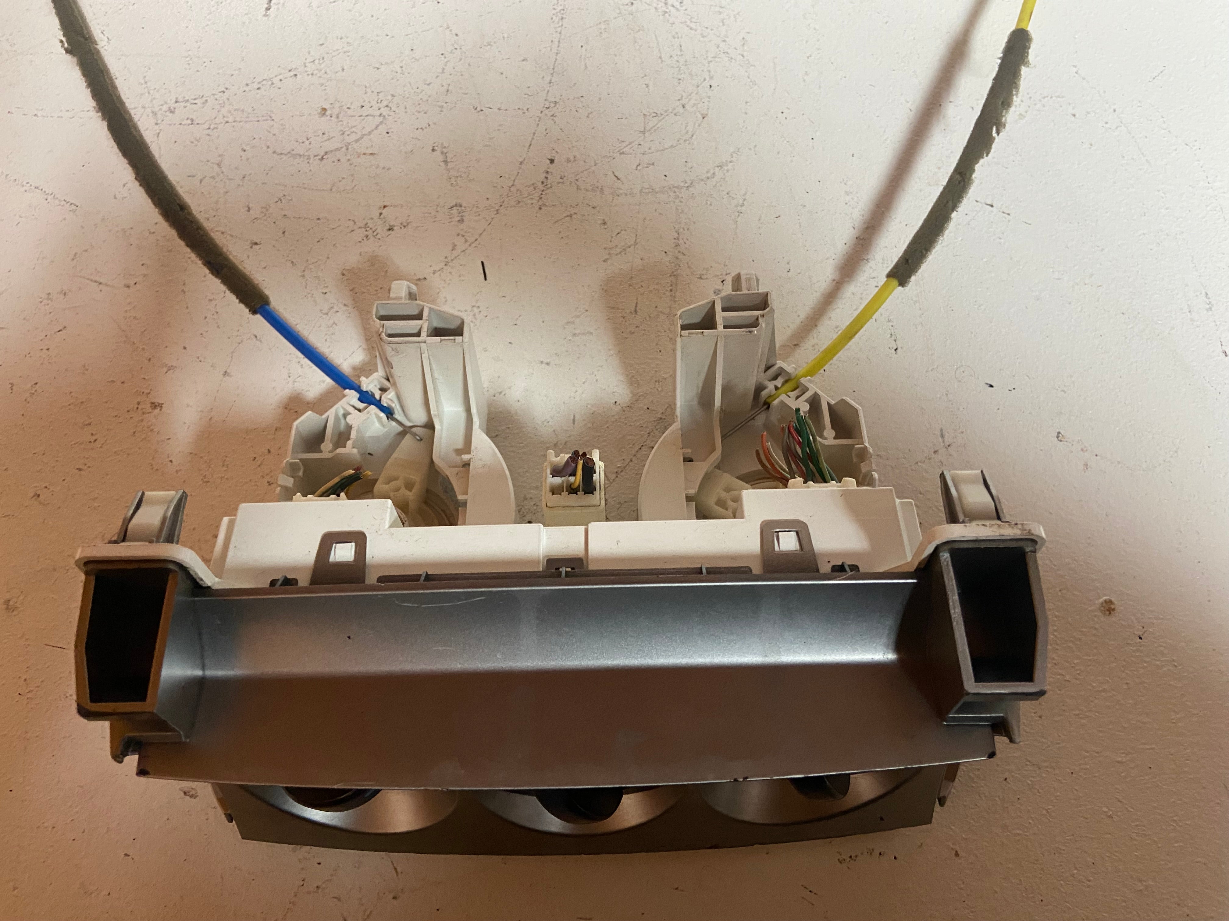 Climate control actuator base with two fan-like modules and attached colored cables
