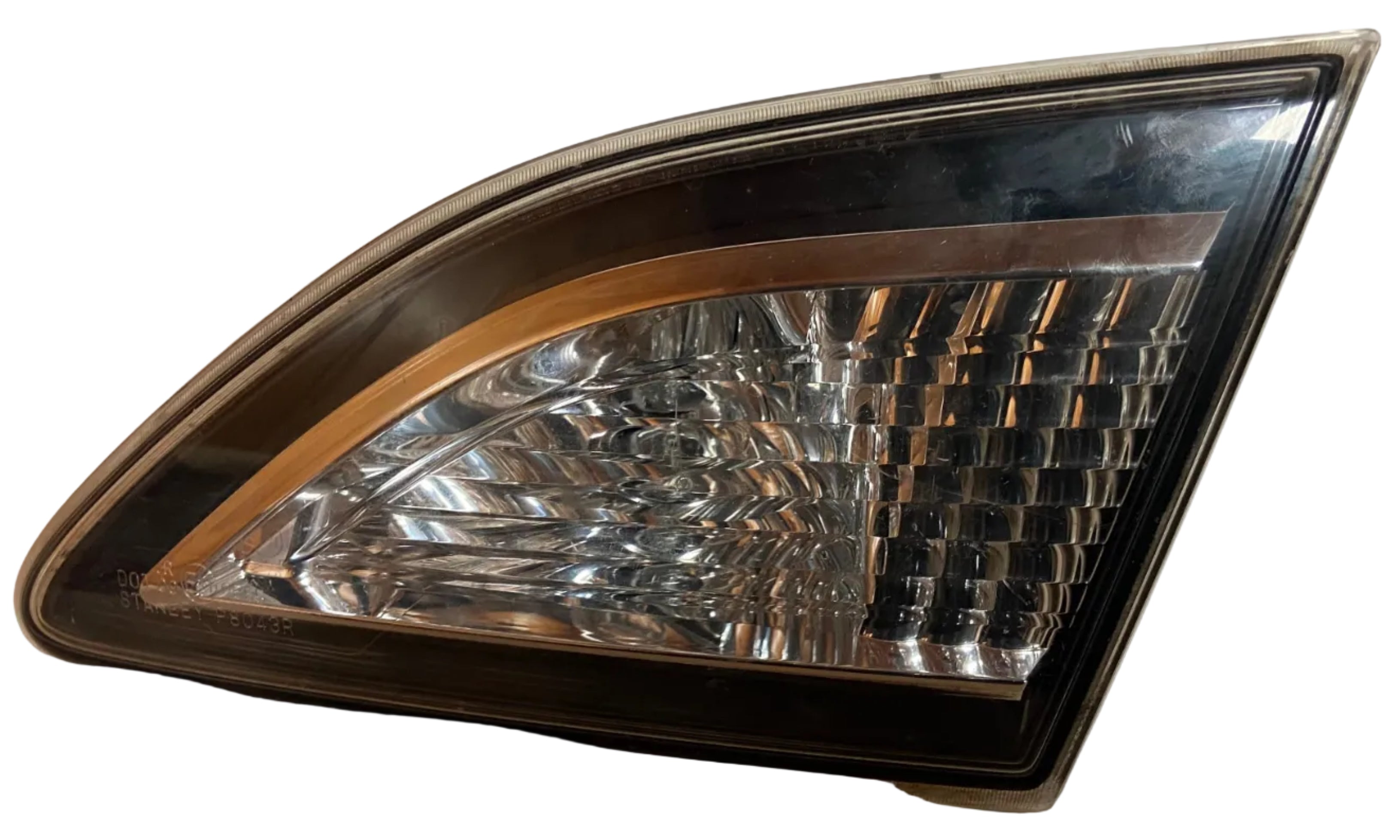 Right rear tail light and reverse lamp assembly, amber trim and clear lens close-up