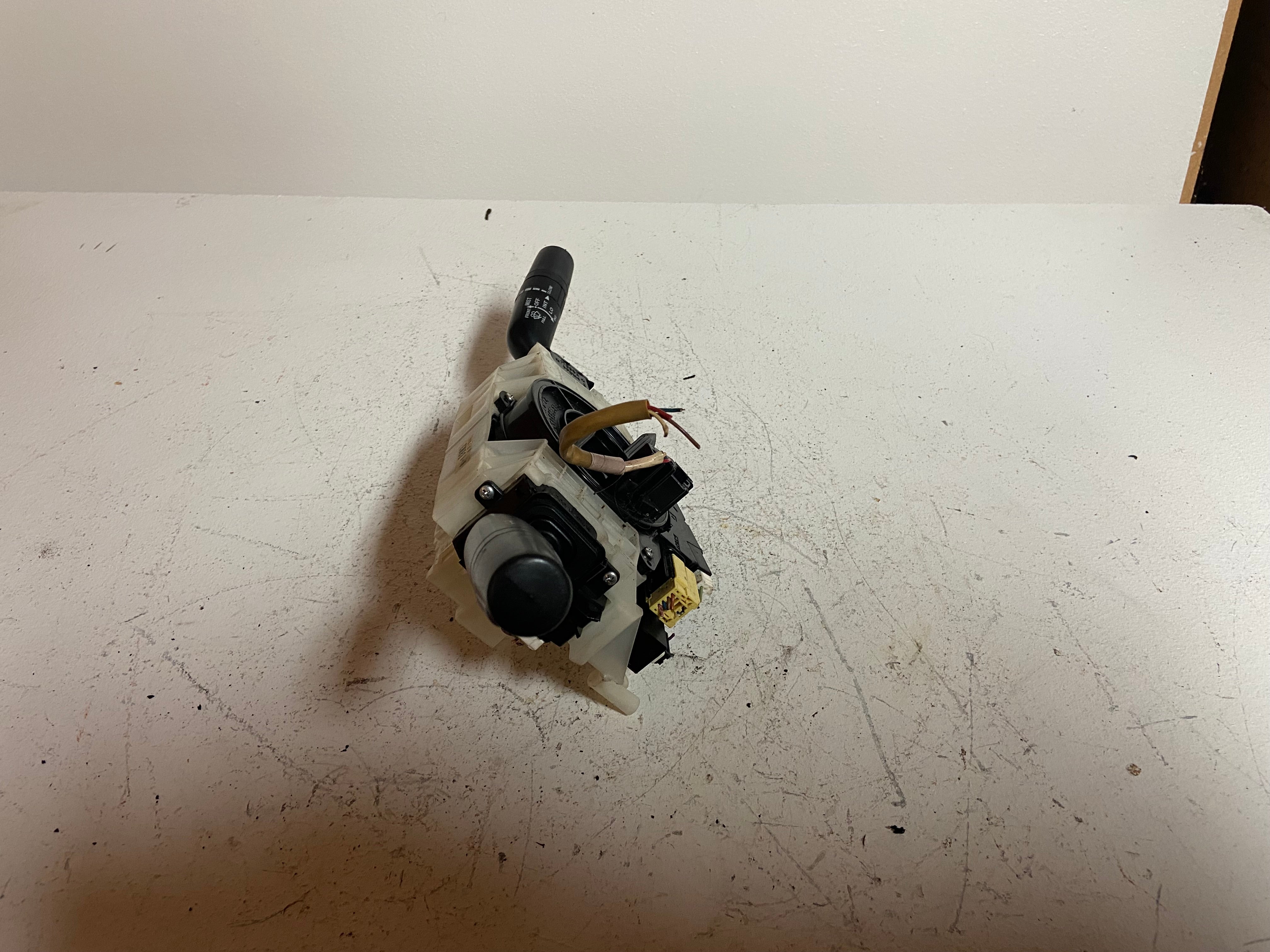 Steering column switch assembly with black switches and wiring on housing