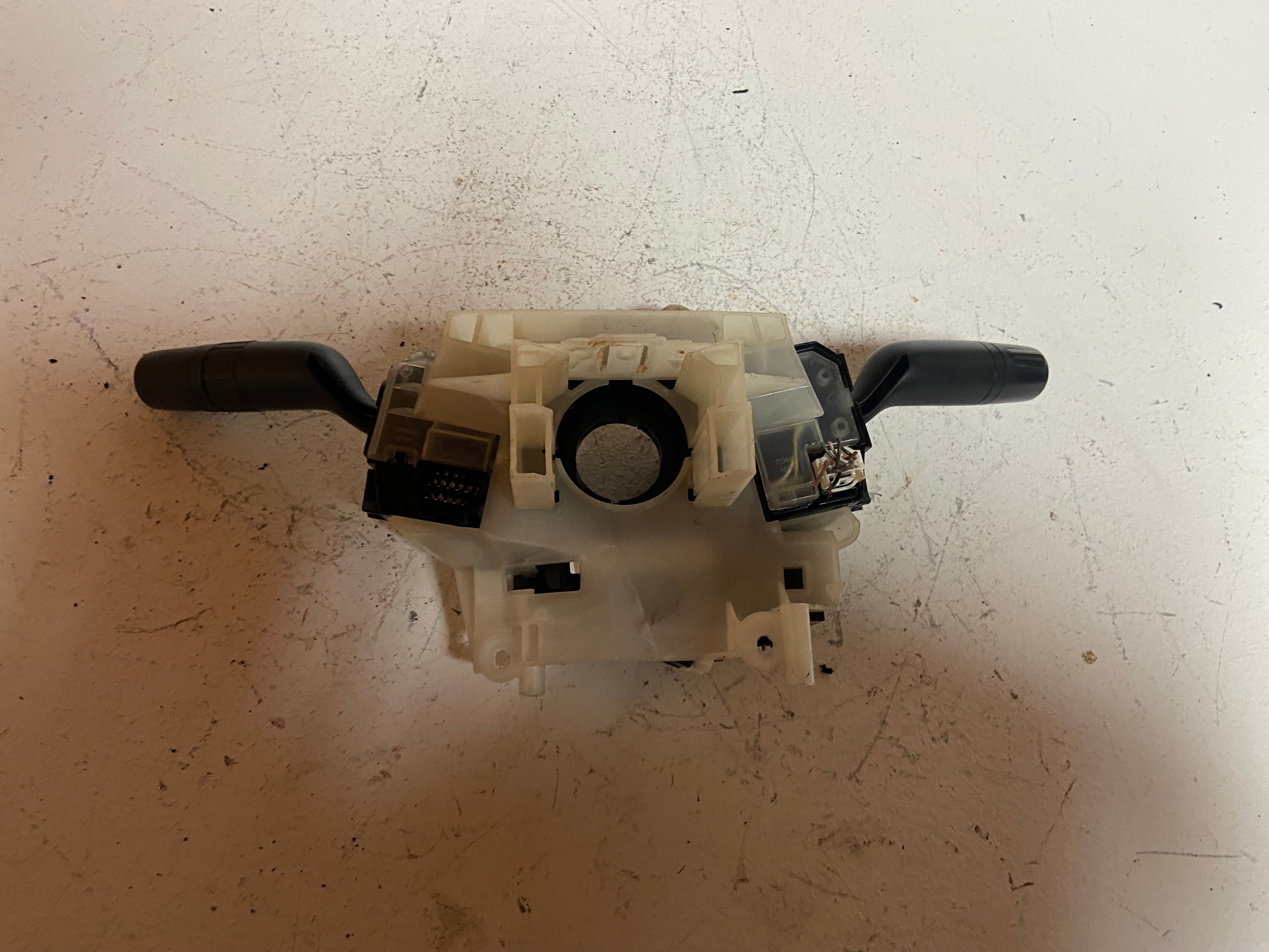 Steering column combination switch assembly with two black lever controls