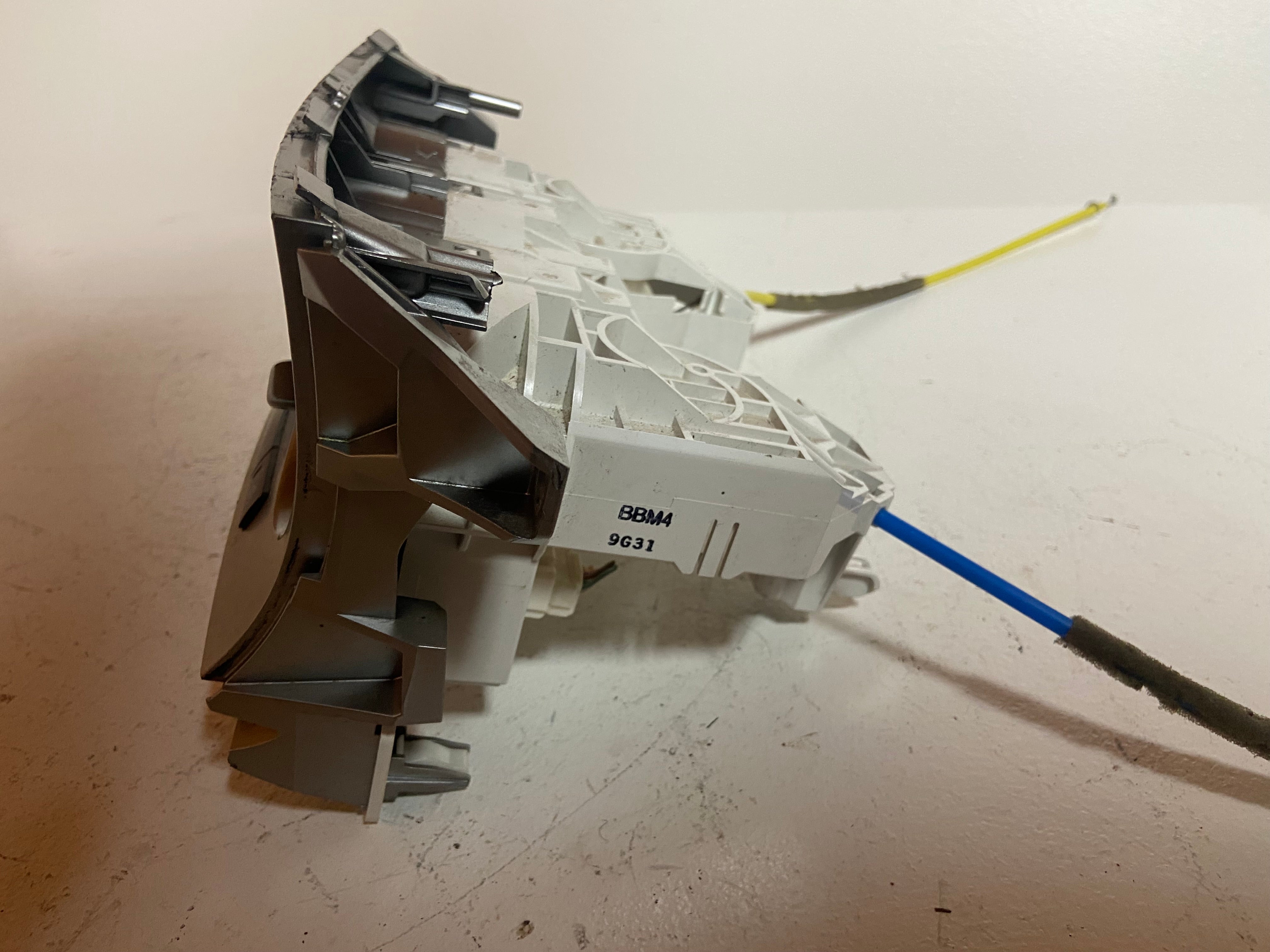 Climate control actuator assembly with white housing and two connected cable leads