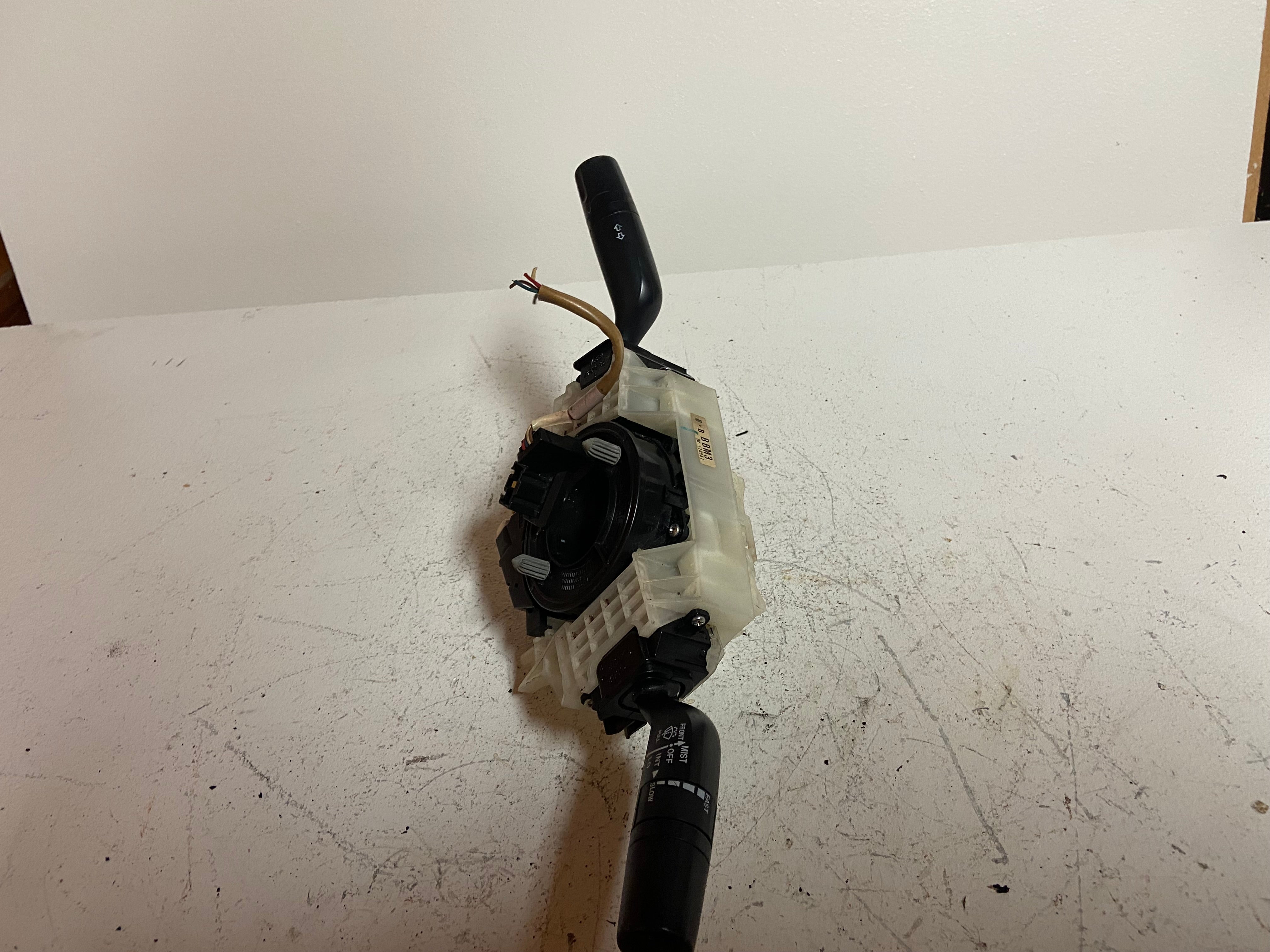 Steering column combination switch assembly with black control module and lever