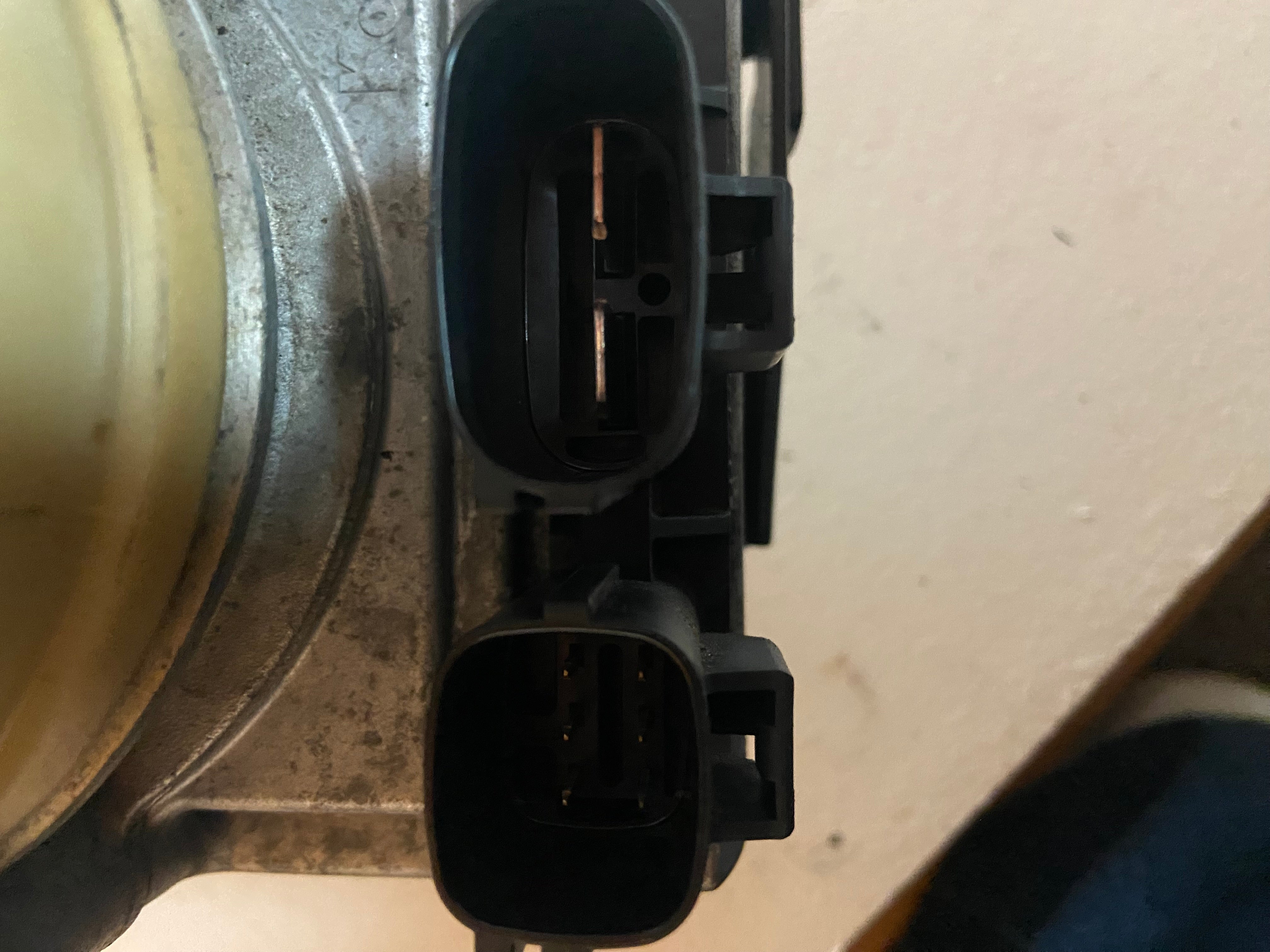 Electro-hydraulic power steering pump assembly with two electrical connectors