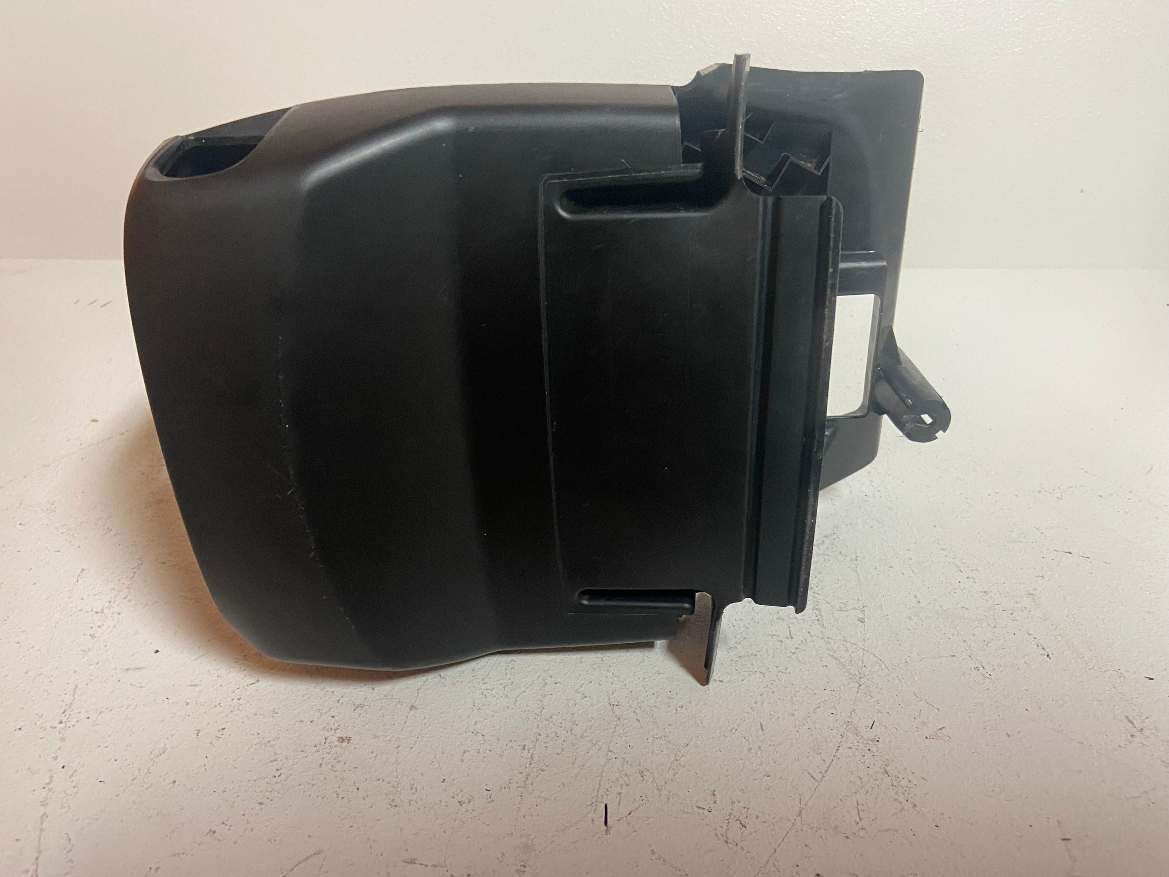 Black plastic upper steering column shroud cover with cutout opening