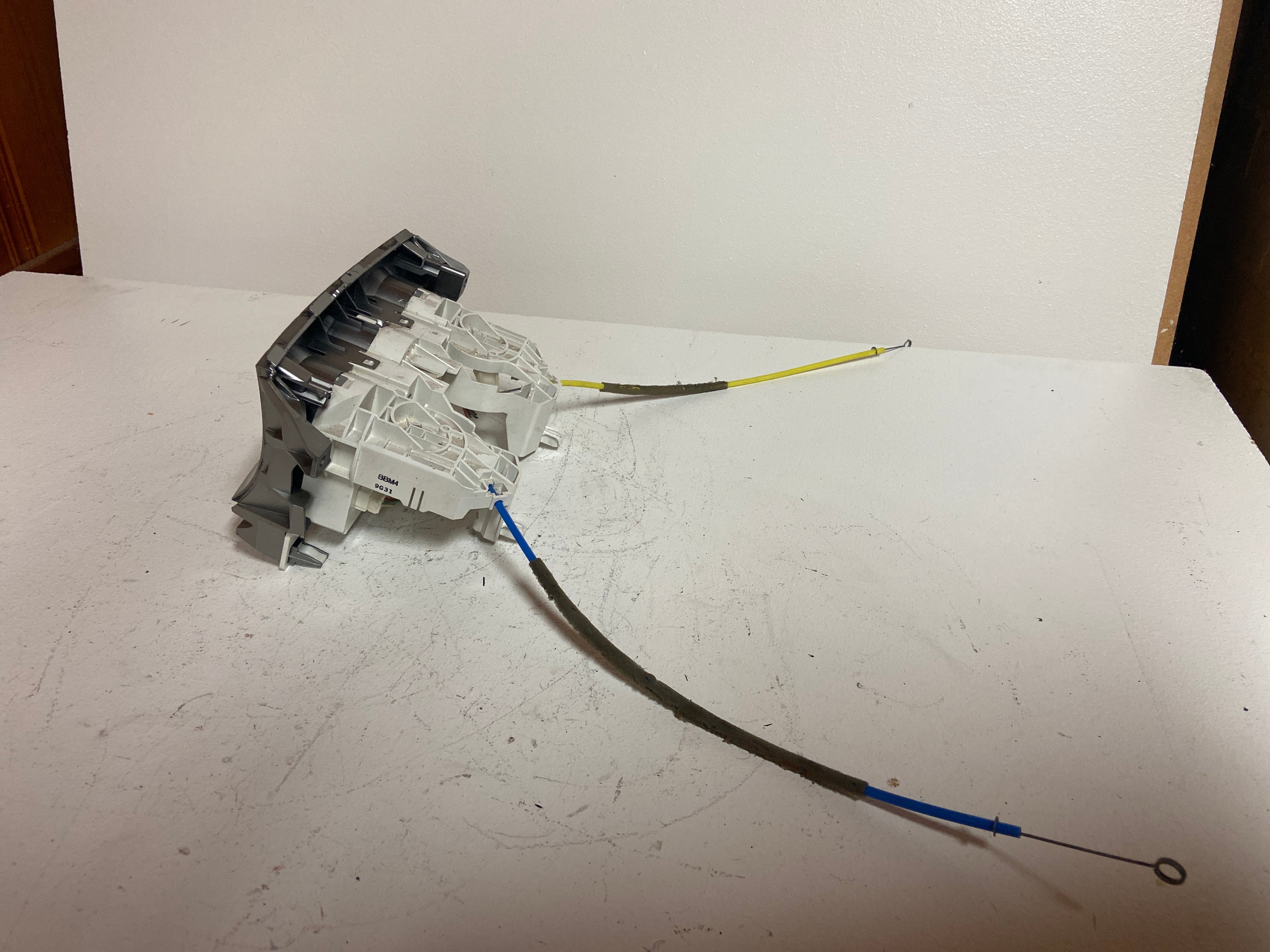 Climate control actuator housing with linked colored blend door cables attached