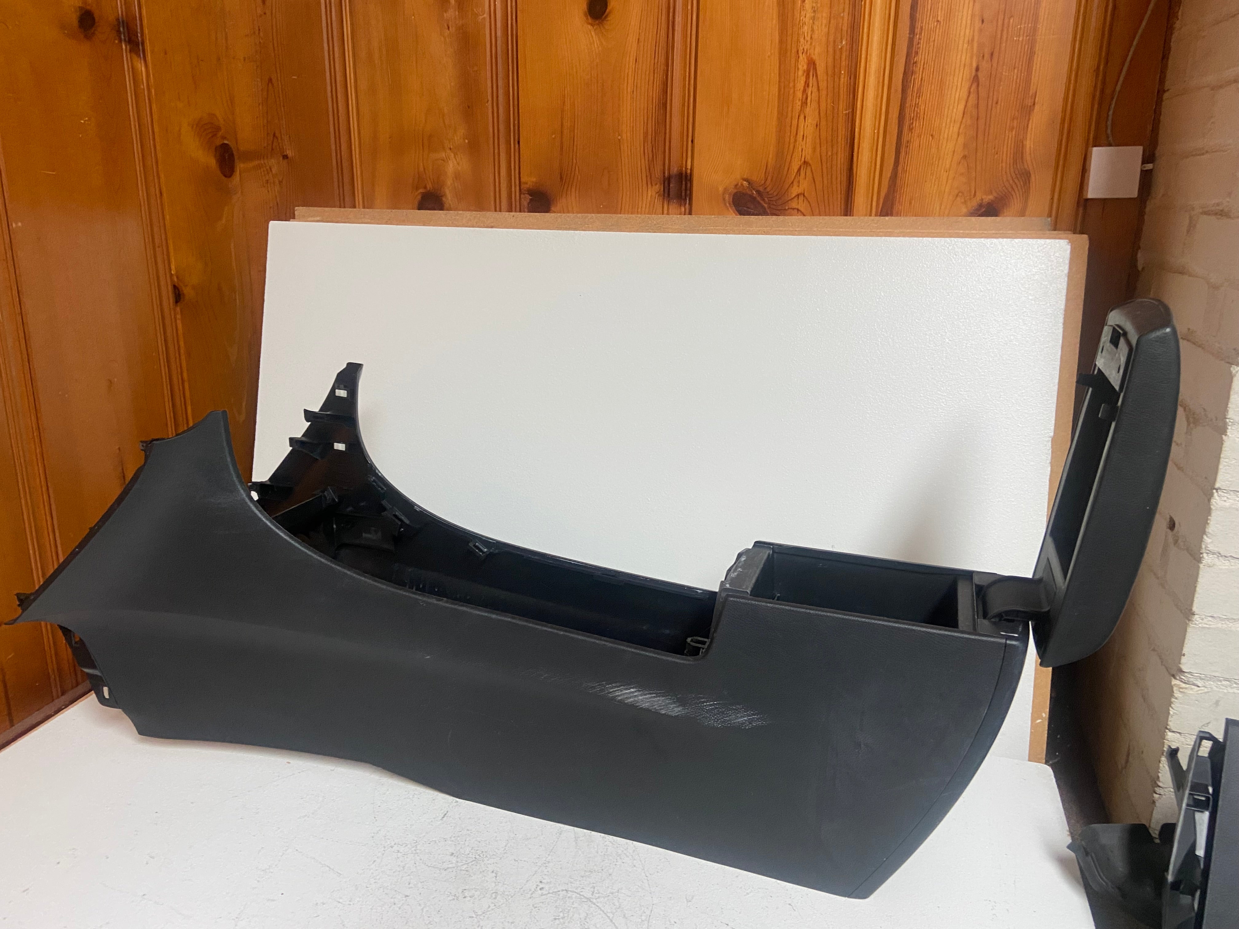 Black console insert with curved side panel and open mounting slots