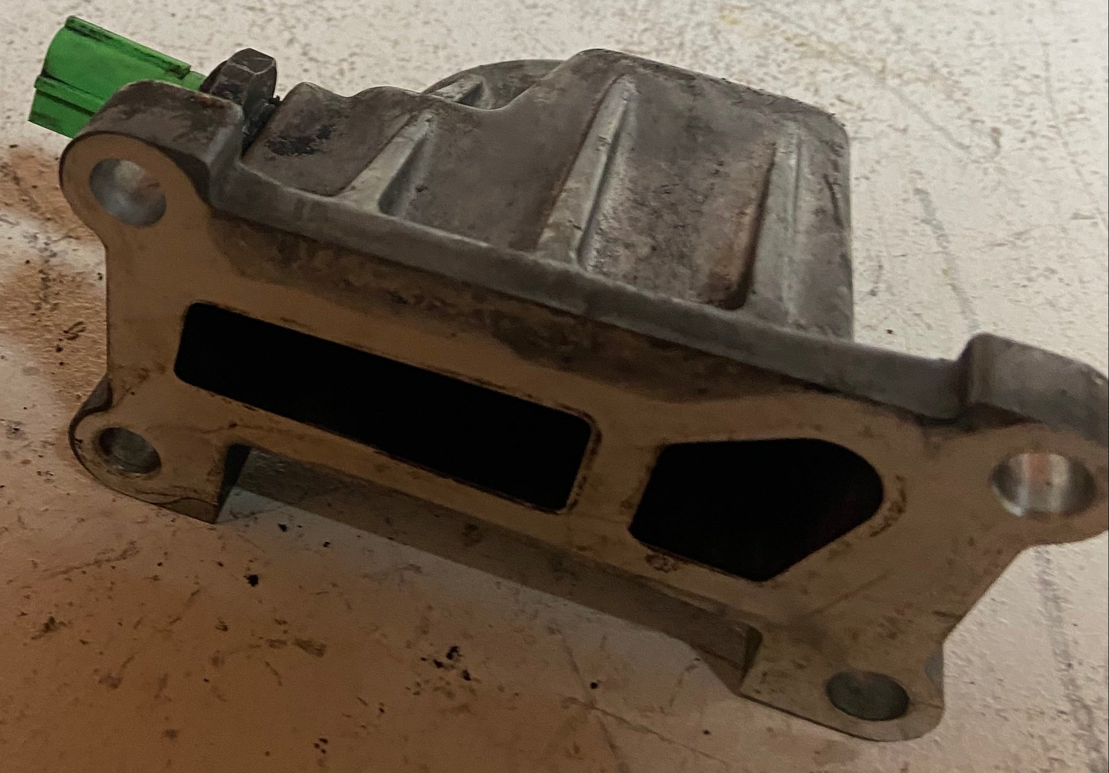 Metal engine oil filter adapter base with rectangular cutouts