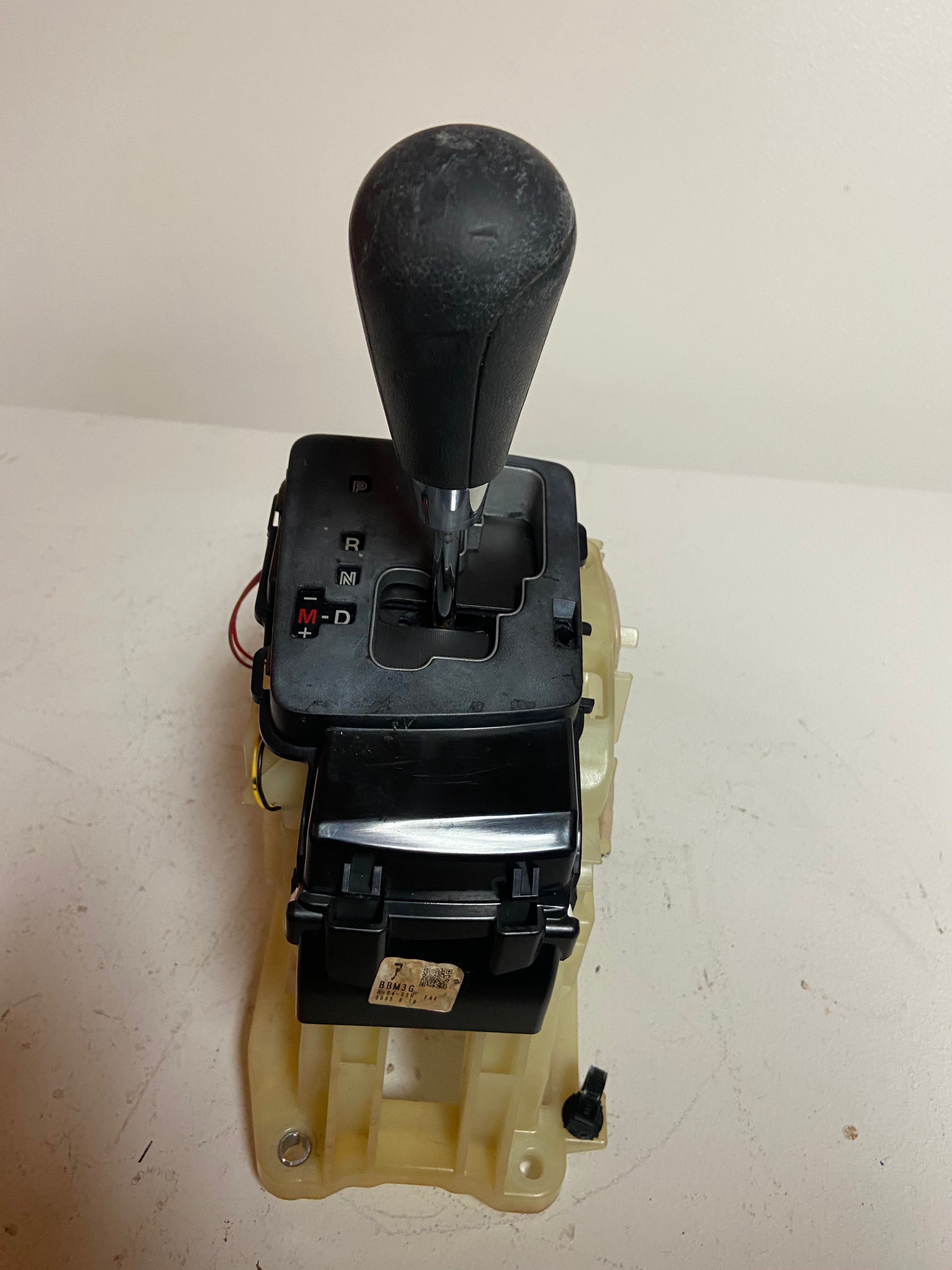 Automatic transmission shifter with black selector panel and shift lever