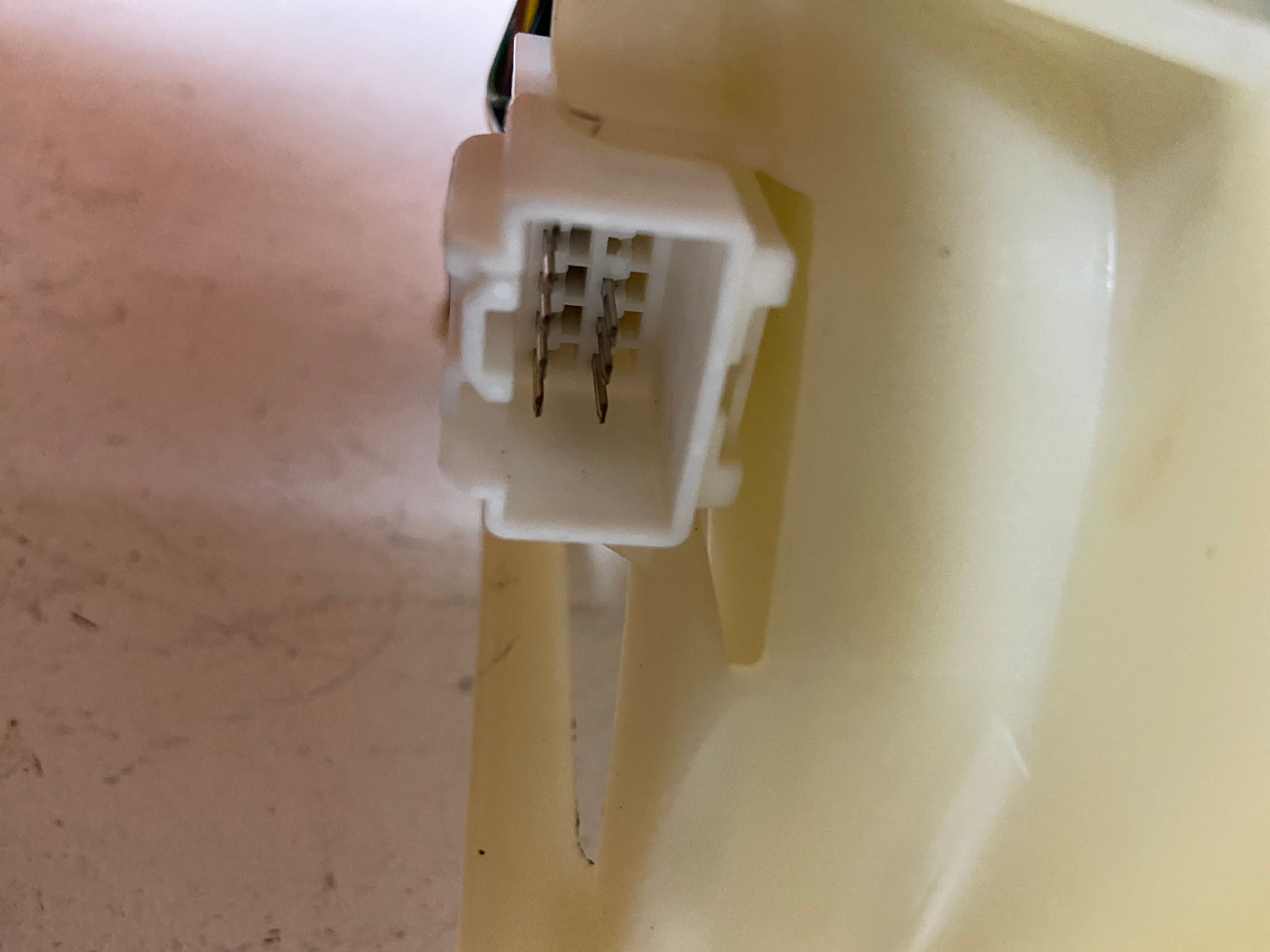 Automatic transmission shifter connector module on beige plastic housing